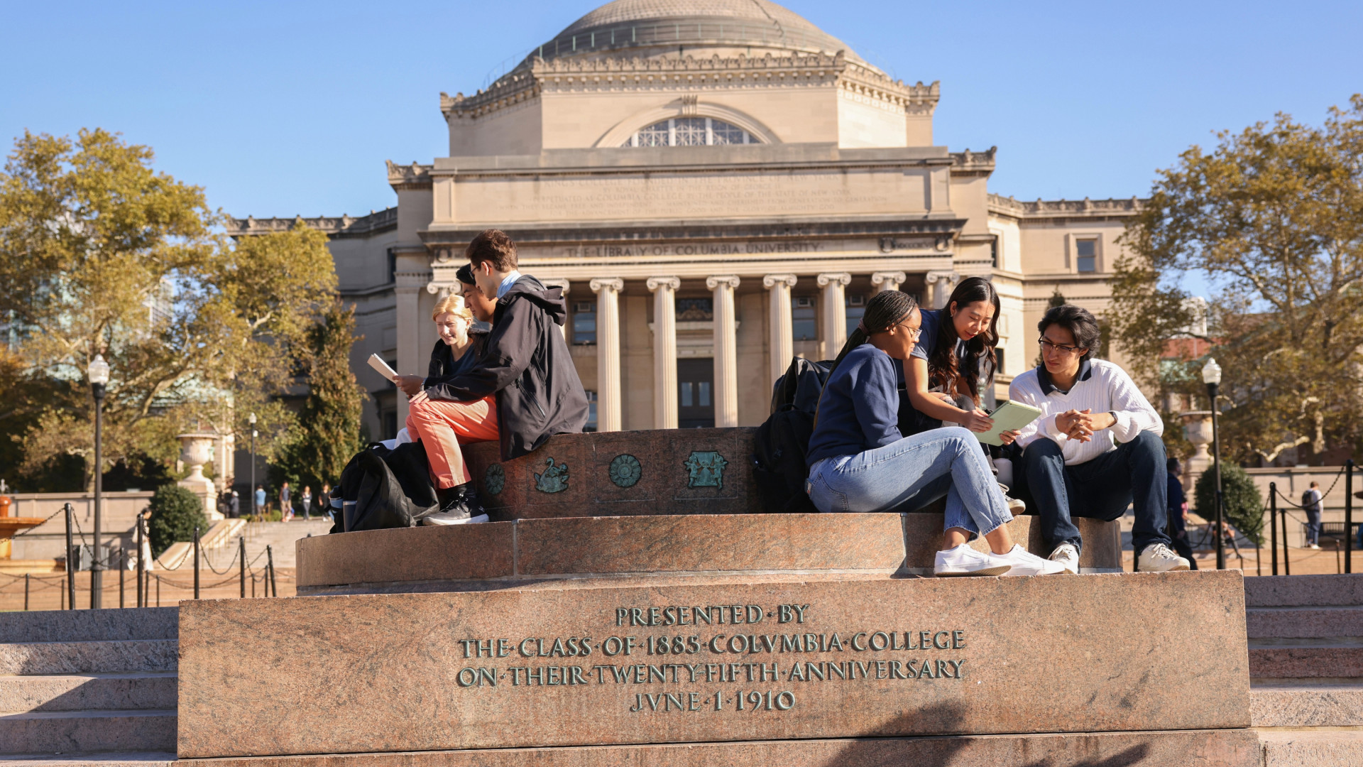 Columbia Engineering students sit beside a fountain in the quad at Columbia University