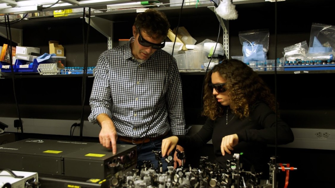 Jim Shuck in his lab with a student